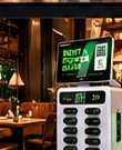 AmpUp kiosk in a restaurant dining room