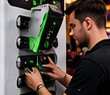 AmpUp technician servicing a wall-mount unit